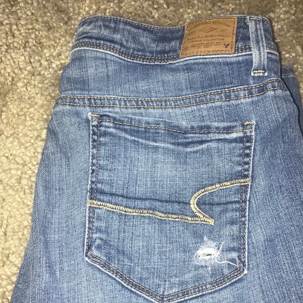 American Eagle jeans with few holes.